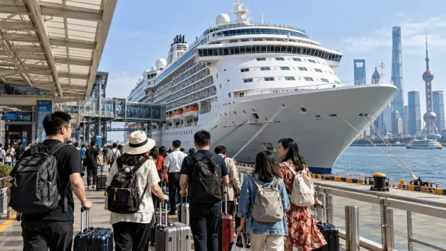 Editorial illustration of a cruise ship near a modern Chinese waterfront terminal.